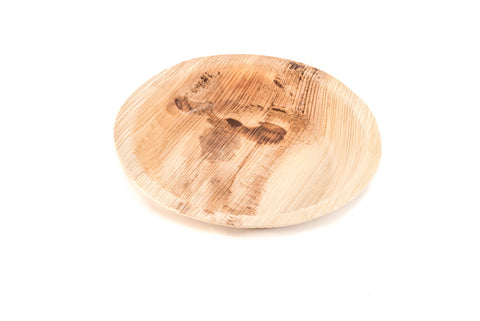 6 inch round palm leaf plate at angle