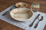 Table setting with palm leaf dishes at angle